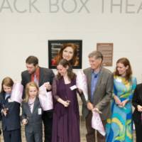 A close-up shot of the ribbon cutting.